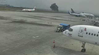 Airport apron with a smoke plume in the background, from the demo recording